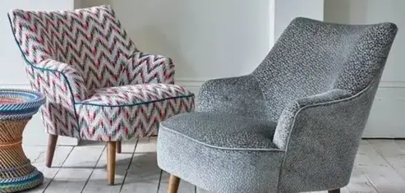 Two stylish armchairs, one with a colorful zigzag pattern