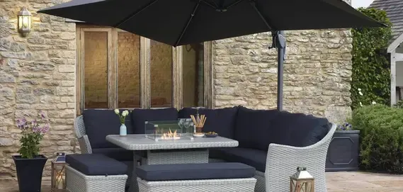 stylish outdoor seating area features a navy sectional couch